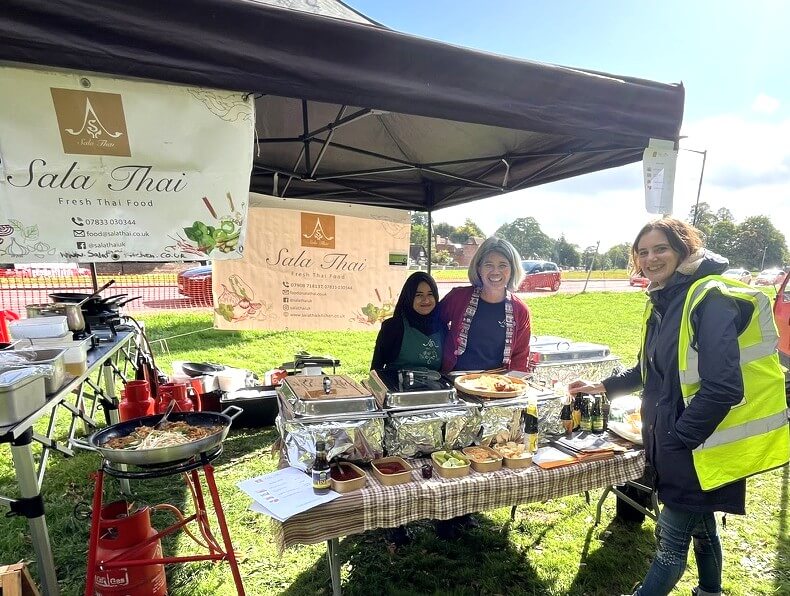 Sala Thai Kitchen serves a customer at the Harpenden Sustainability Market